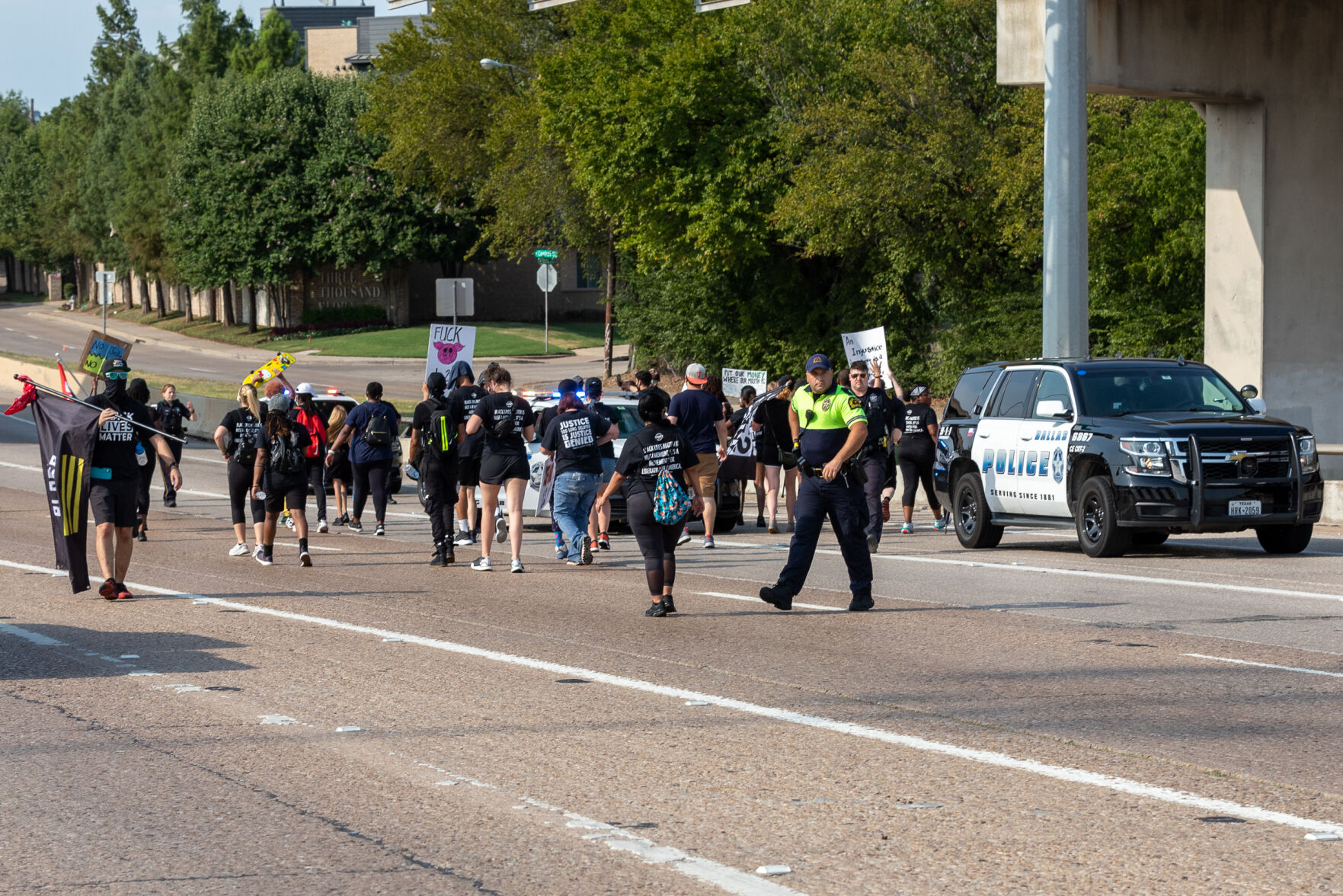 Photos: Protesters march down U.S. 75, chant outside home of Dallas mayor to call for racial justice